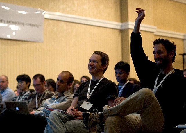 A picture of an audience engaging during a presentation.