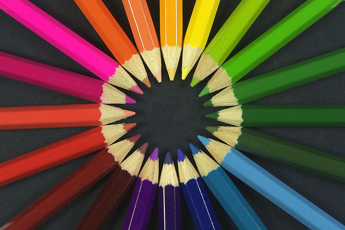 Colored pencils arranged in a circle.