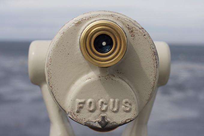 A picture of mounted binoculars with the word 