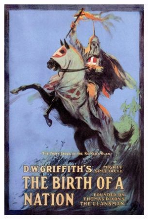 The movie shows a hooded KKK member riding a rearing horse and holding a fiery cross.
