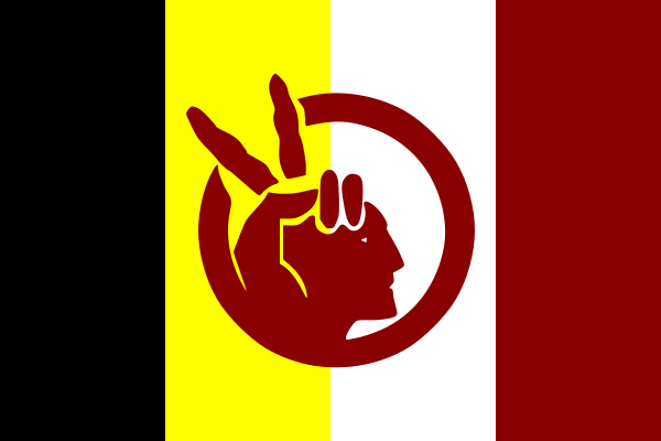 The image shows the flag of the American Indian Movement. The flag has four thick vertical stripes in the background. From left to right, the stripes are black, yellow, white, and maroon. Superimposed in the center of the flag is a maroon profile of a Native American man with a peace sign next to his head that doubles as a headdress.