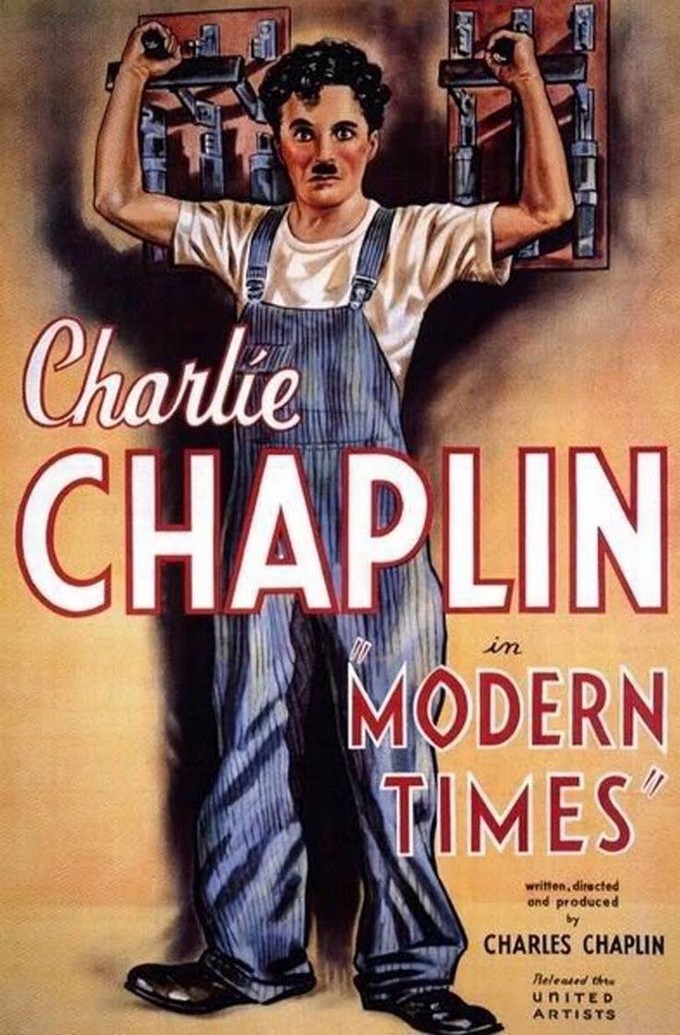The illustration on the poster depicts Charlie Chaplin, with his signature mustache, wearing blue overalls and a t-shirt. He has both hands reaching behind him. With each hand he grips the handle of a circuit breaker. The superimposed text on the poster reads, 