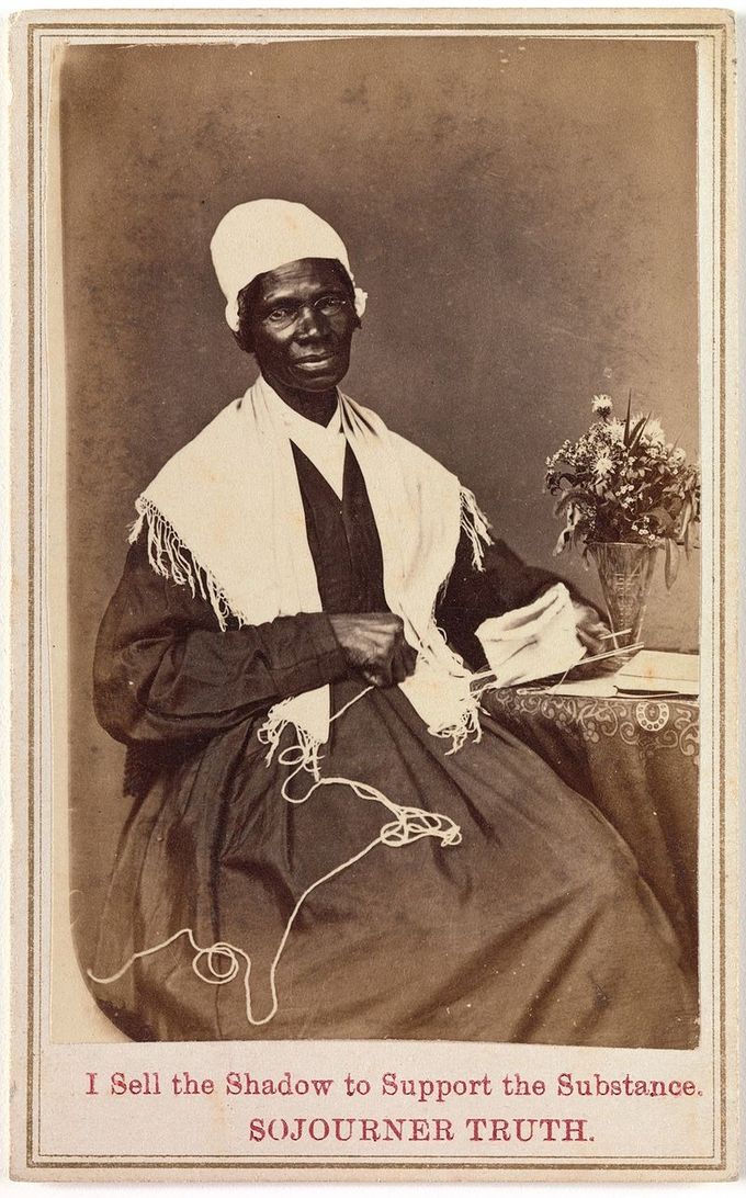 The carte to visite shows Sojourner Truth knitting, sitting next to a small table with a vase of flowers. The inscription at the bottom of the card says 