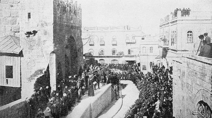 The formal transfer of Jerusalem to British rule. A native priest reads the proclamation from the steps of the Tower of David.