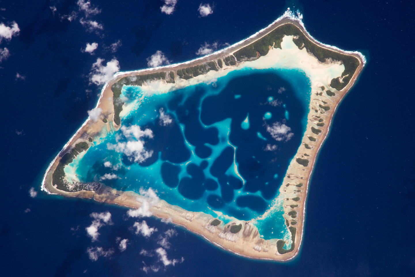 Atafu Atoll. It appears to be an island that is nearly covered in a lake. There is just a thin bar of sand showing above the sea.