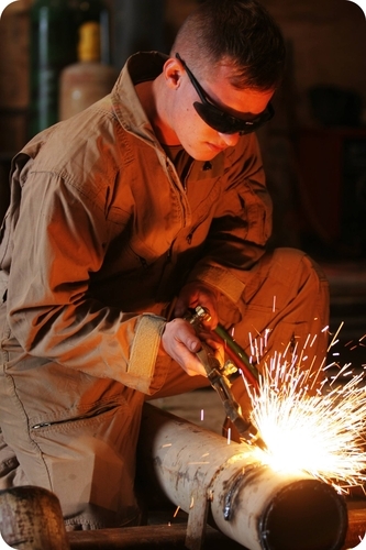 The heat generated by an acetylene torch is best calculated using Hess's Law