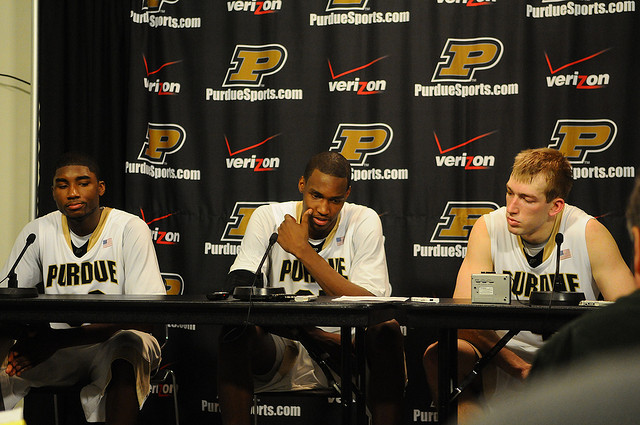 Three Purdue University basketball players answering questions at a panel.