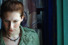 Woman looking down with concentration