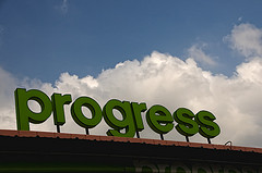 Progress sign on building