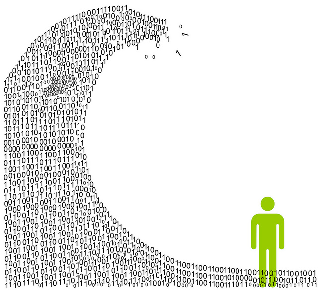 Silhouette of man being overtaken by wave made out of 1's and 0's
