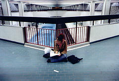 Woman studying on floor 