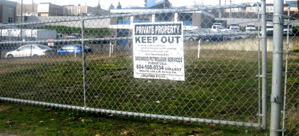 A chain link fence with a sign that says Private Property, Keep Out
