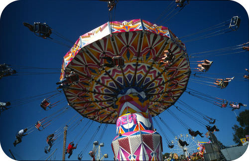 Swings on a spinning carnival ride