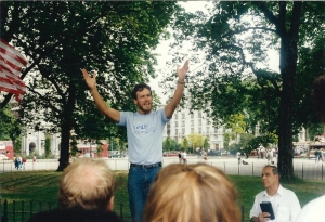 A man addressing a crowd.