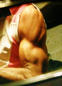 Close-up photograph of weightlifter's bicep and shoulder