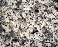 Figure 2. Granite is made of four minerals, all visible to the naked eye: feldspar (white), quartz (translucent), hornblende (black), and biotite (black, platy).
