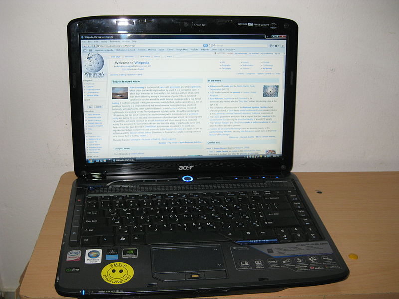 An Acer Aspire 4930G laptop opened, showing the Wikipedia Home Page.