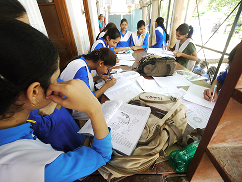 A photograph shows students studying.