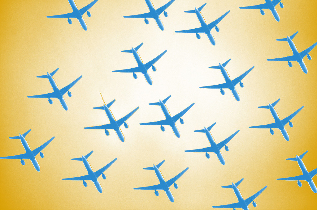 Drawing of twelve blue airplanes against a yellow background. Planes are seen from below.