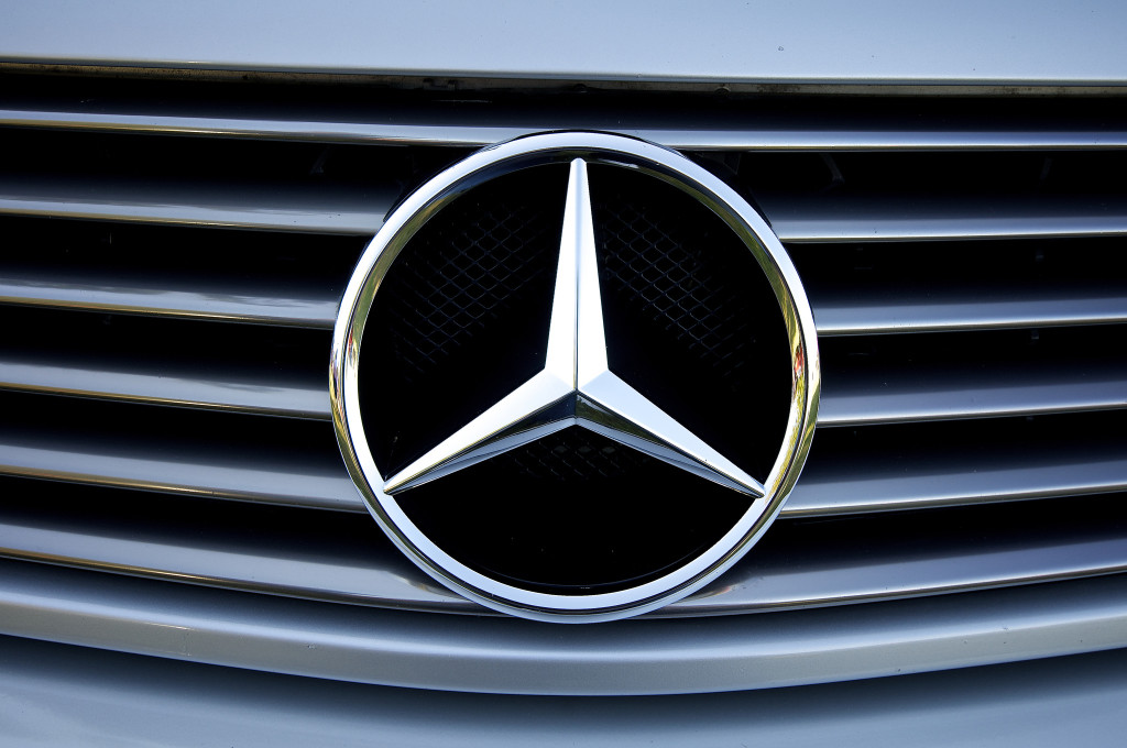 Photo of the Mercedes-Benz hood emblem—a silver ring trisected in the middle.