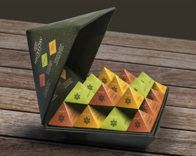 A pyramid-shaped box that opens to reveal stacked pyramid-shaped boxes of teas.