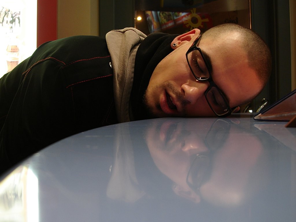 Photo of a young man asleep or 