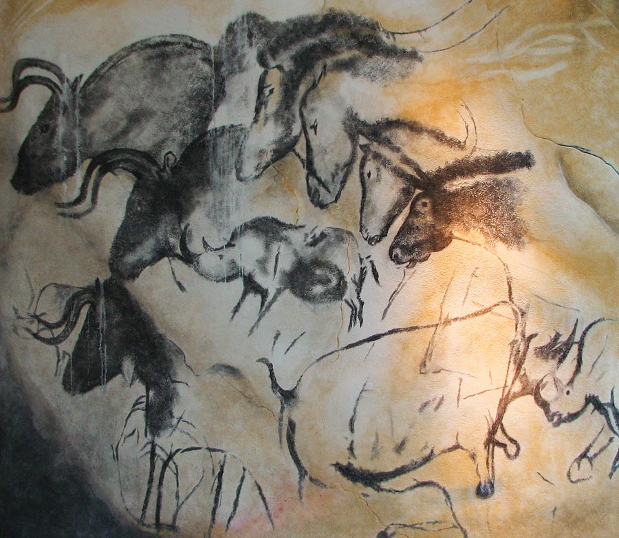 Cave painting with bison, rhinos, and horses
