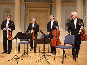 A string quartet. From left to right: violin 1, violin 2, cello, viola