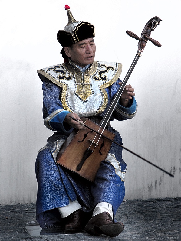 A Mongolian man playing the morin khuur.