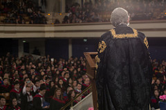 A man giving a speech at a university