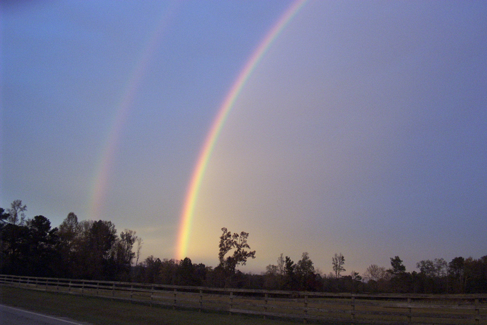 A double rainbow with spectacular bands of seven colors.