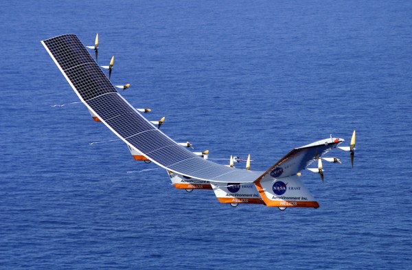 A solar-powered aircraft flying over the sea. Solar cells are on the upper surface of the wings, where they are exposed to sunlight.