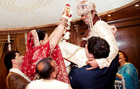 A photograph shows a bride and groom in a wedding ceremony.