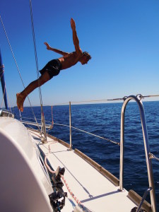 A person diving off a boat.
