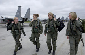 Female pilots walking toward their planes.