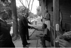 President Johnson shaking hands.
