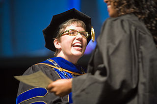 A woman in a graduation gown
