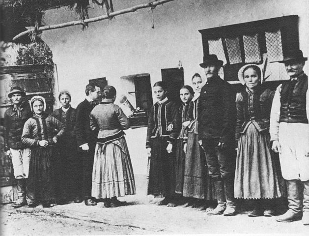 Figure 2. Béla Bartók using a gramophone to record folk songs sung by peasants in what is now Slovakia.