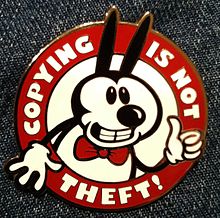 Pin with a Mickey-Mouse look-alike and the words 