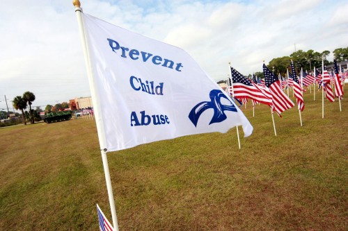 A flag with the words Prevent Child Abuse on it.
