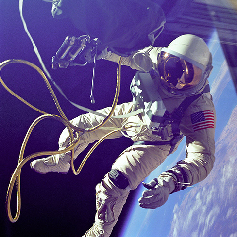 A photo of an astronaut on a spacewalk is shown.