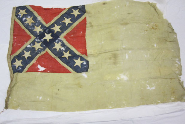 Photo of a tattered Confederate flag