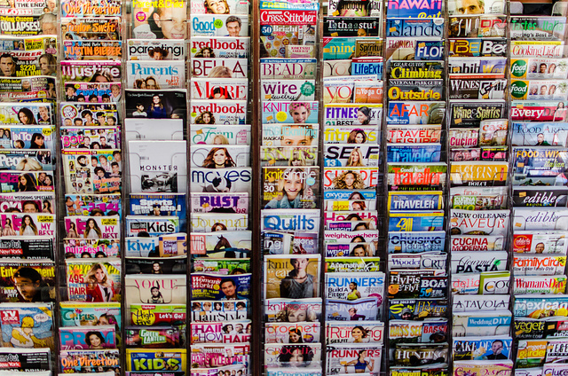 photo of magazines at a news stand.