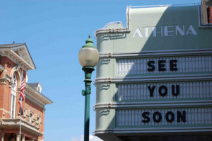 Movie marquee for the Athena theater. Message reads 