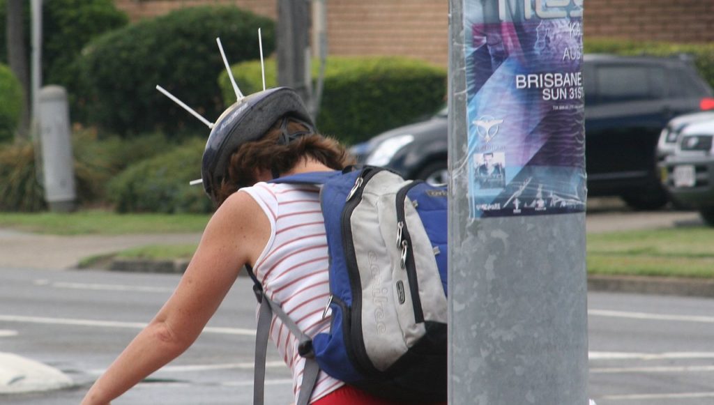 an Australian biker with zip ties sticking out of his helmet