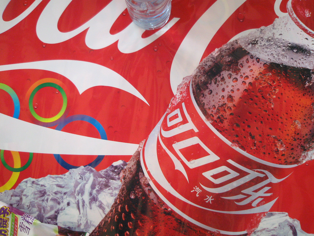 Advertisement featuring bottle of Coca-Cola with a Chinese label.