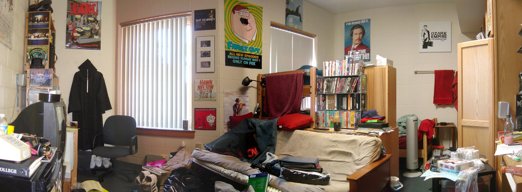A room full of pop-culture-themed posters, books, and movies.