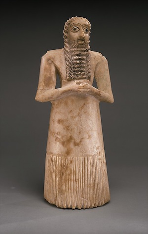 Standing Male Worshiper from Tell Asmar, Ancient Sumerian, c. 2900-2600 B.C.E., Gypsum alabaster, shell, black limestone, bitumen, 11 5/8 x 5 1/8 x 3 7/8 (Metropolitan Museum of Art)