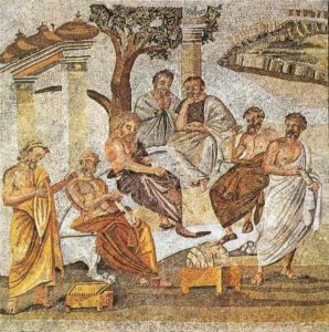 Tile mosaic depicting several male figures in togas outside, under columns and trees