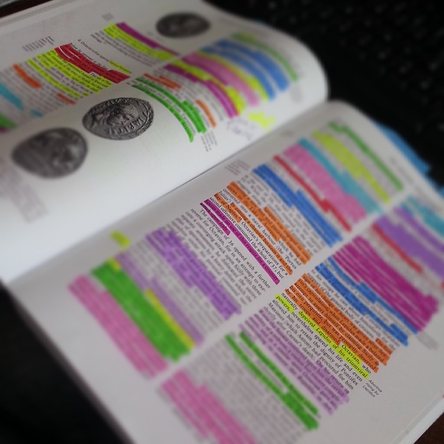 a textbook. nearly all of the text is highlighted in multiple colors